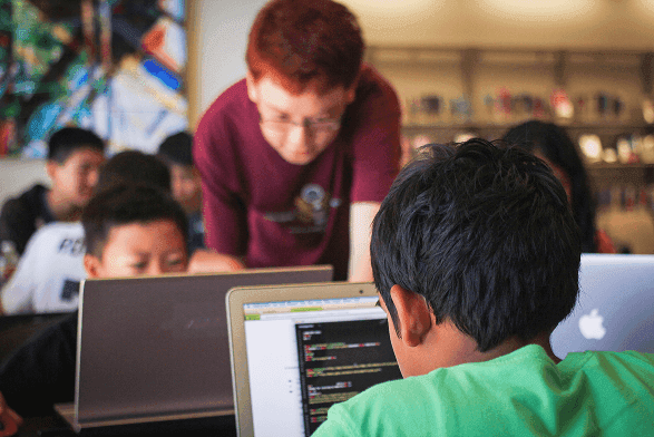 A study coach helping a student with homework