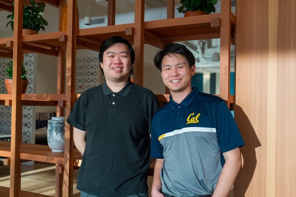 Two Learning Lab mentors in the office library
