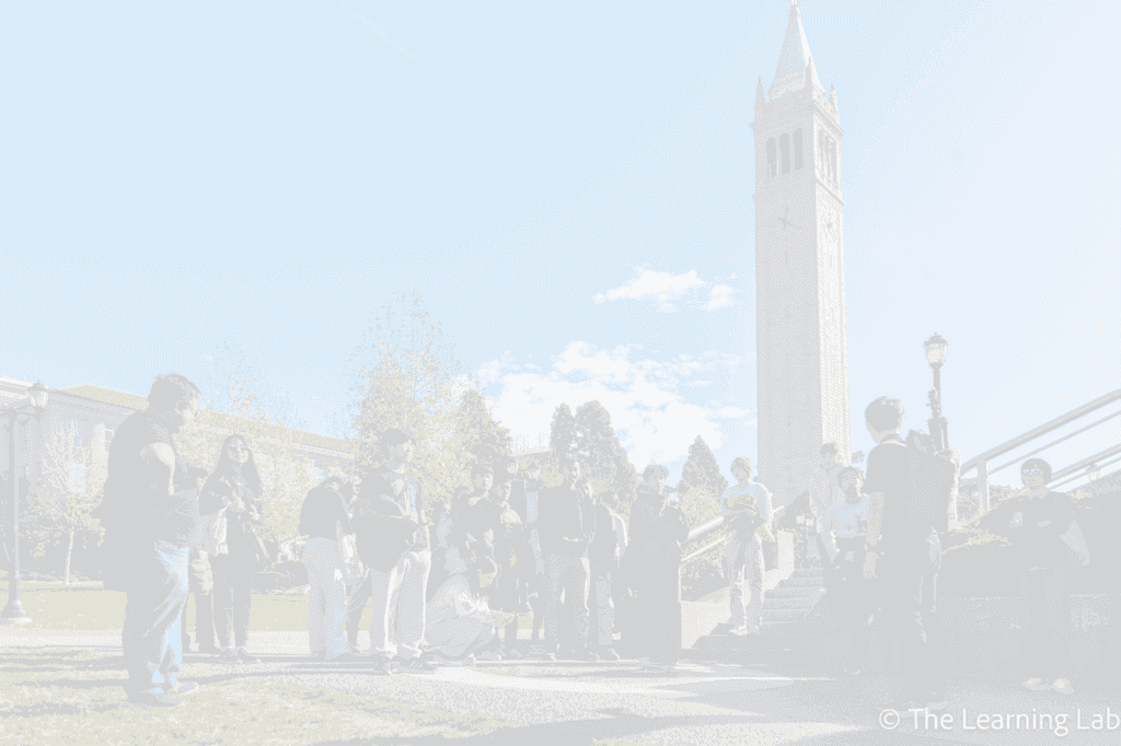 Students on a campus tour beside the UC Berkeley Campanile
