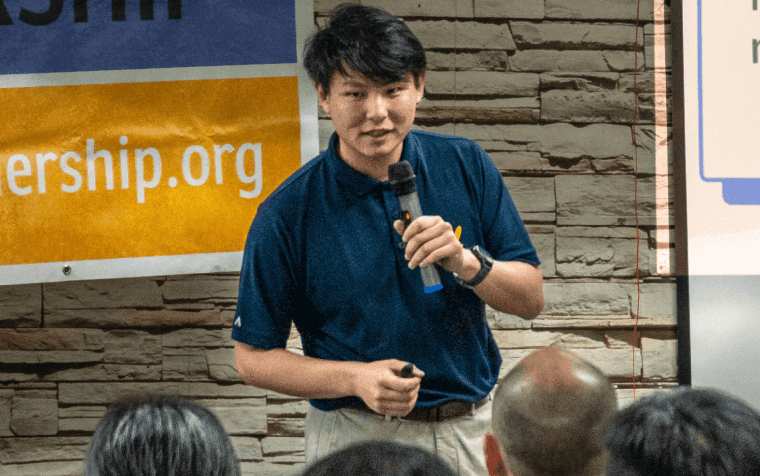Daniel speaking to an audience