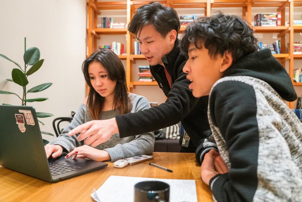 A mentor working with a high school student