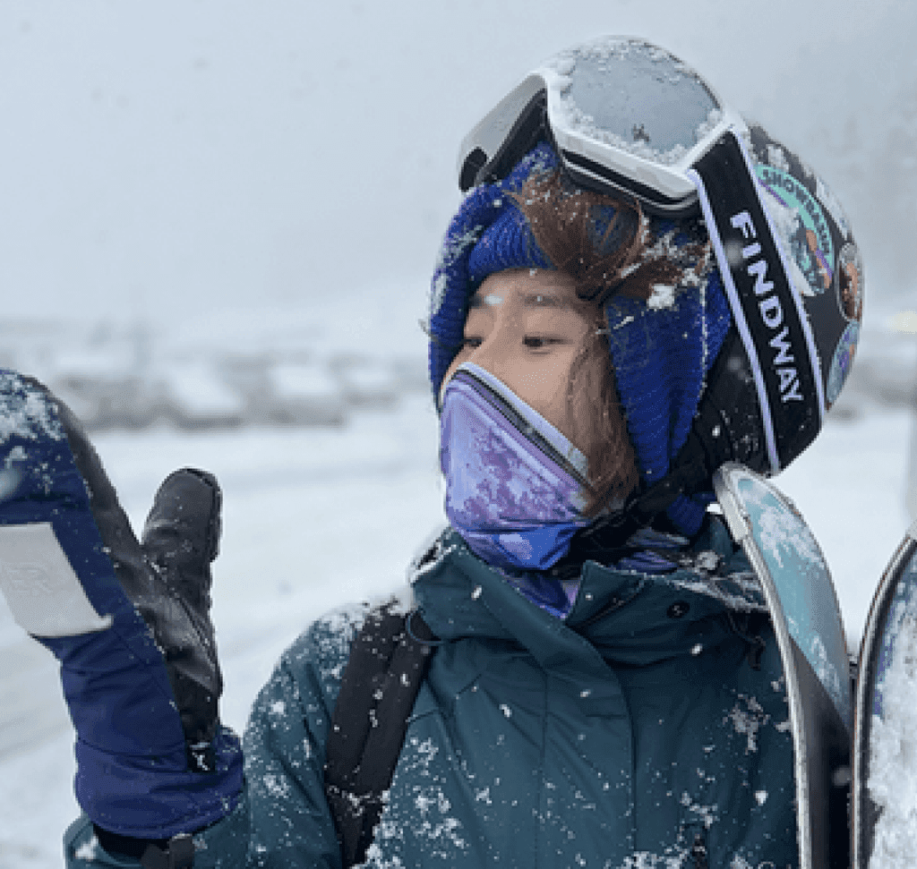 Yao Wang skiing in the snow